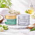 Two jars of Skin Magic cream on a marble surface with natural elements.